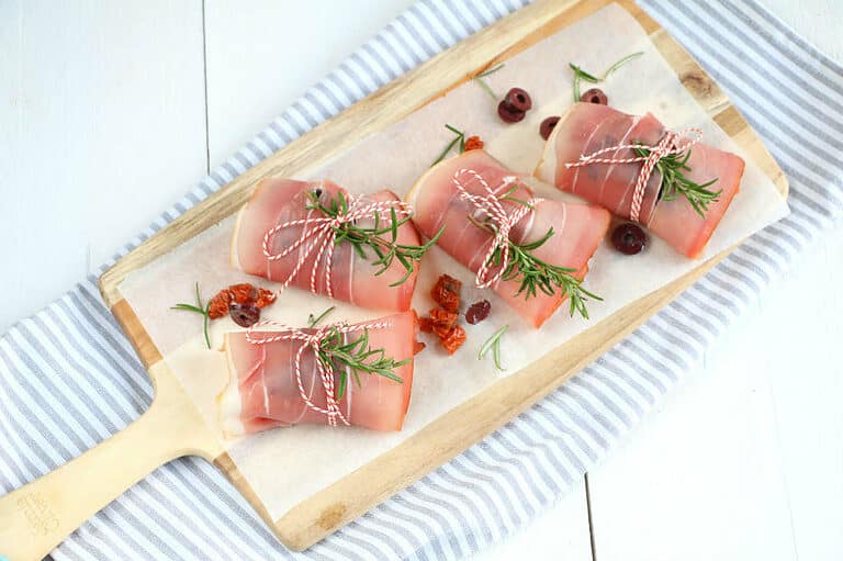 Kippendijen met rauwe ham uit de oven